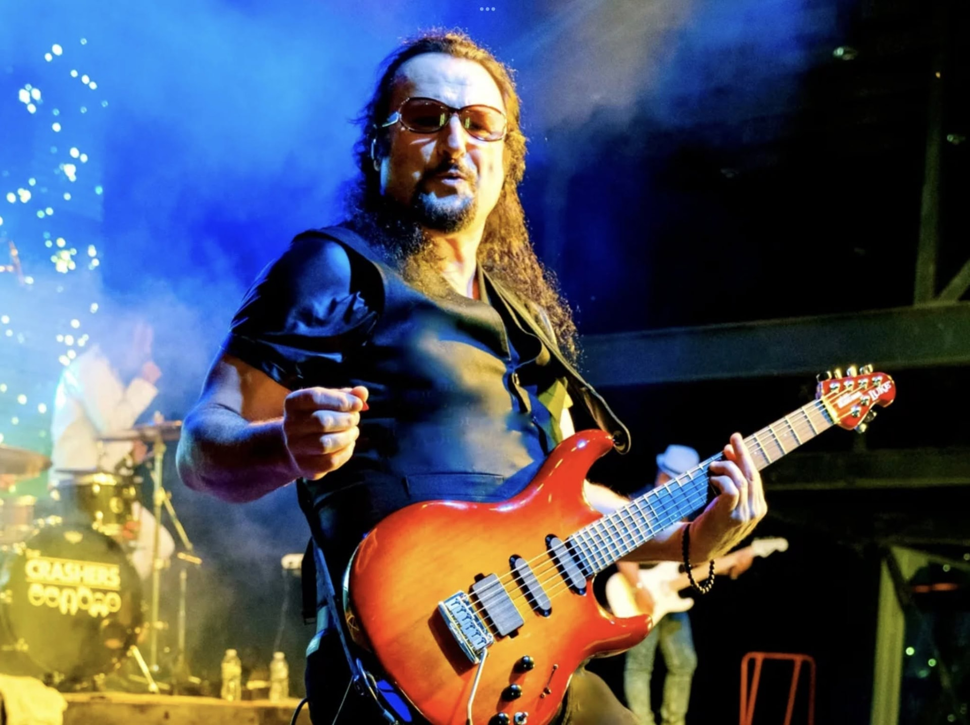Shane Isenberg playing guitar on stage